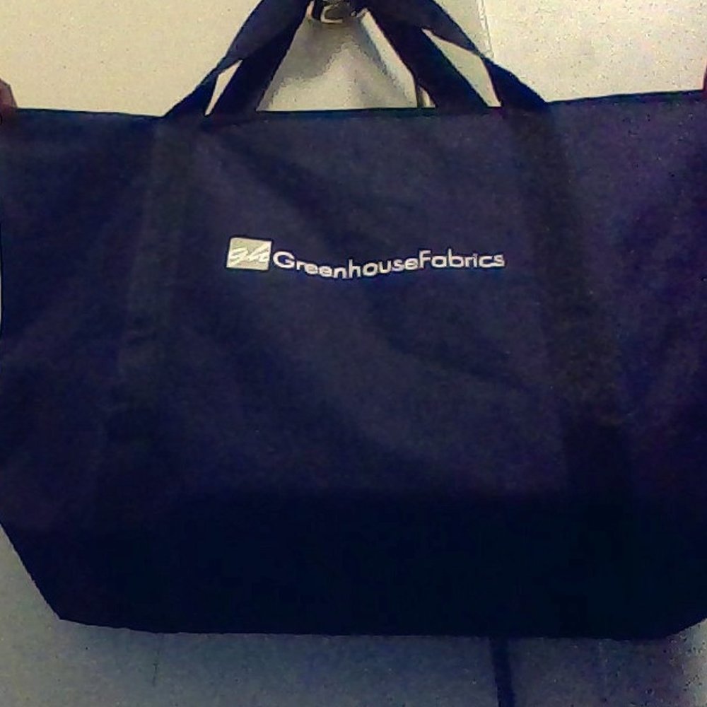 a black Green house frabrics hand bag